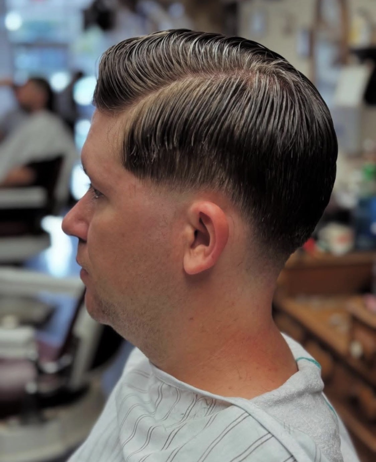 Classic side part with low fade